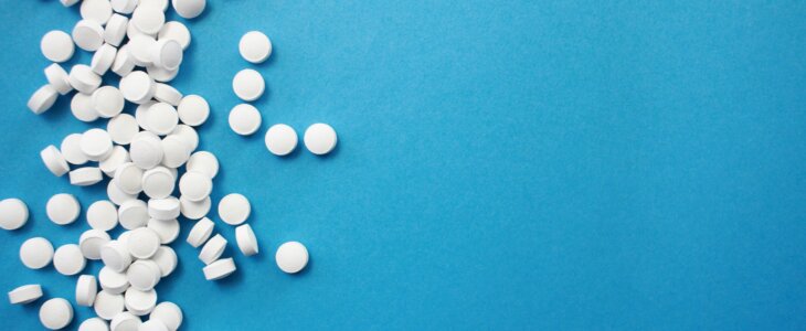 White Pills on Blue Background – Medicaid Planning and Medical Expenses