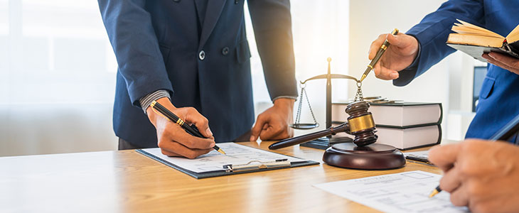 Attorneys reviewing probate documents, illustrating common probate issues and solutions in Florida.