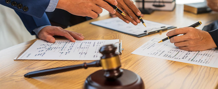 Attorneys reviewing estate planning documents, highlighting key questions for Hillsborough County residents.