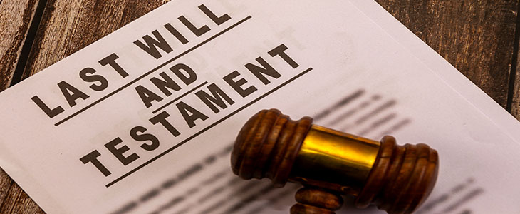 Legal document and gavel on wooden background. Estate planning, inheritance, and probate law concept.