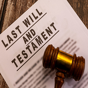 Legal document and gavel on wooden background. Estate planning, inheritance, and probate law concept.