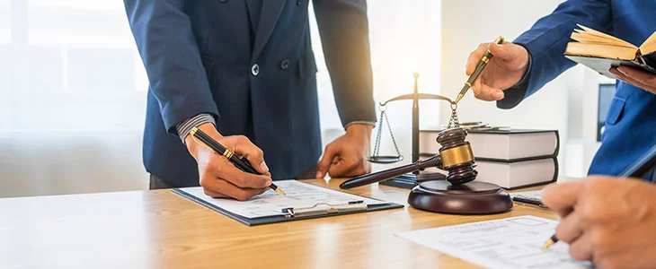 Attorneys reviewing probate documents, illustrating common probate issues and solutions in Florida.