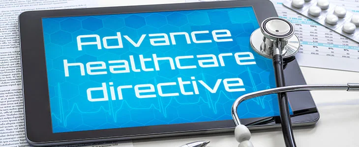A tablet shows Advance healthcare directive with a stethoscope and pills in florida.